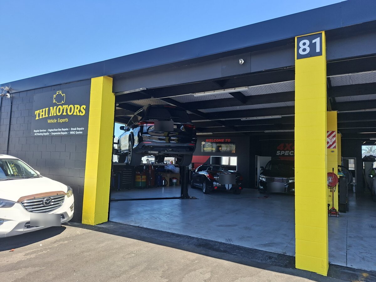 The THI Motors workshop at 81 Huia Road, Otahuhu, with both bay doors open